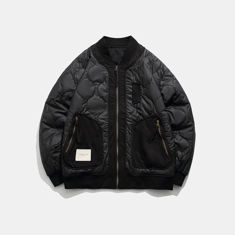 Black quilted bomber jacket with zippered pockets and ribbed collar on white background