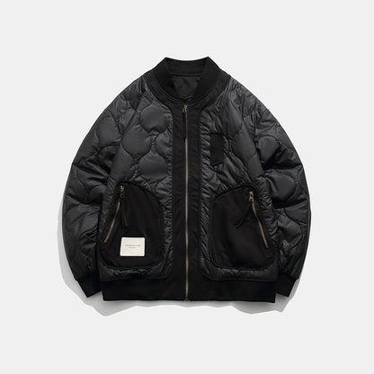Black quilted bomber jacket with zippered pockets and ribbed collar on white background