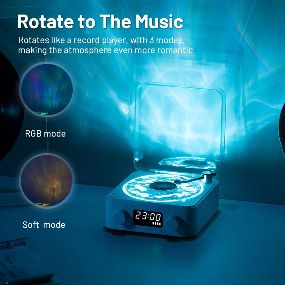 White projection lamp shaped like a record player with blue light and digital clock showing 23:00