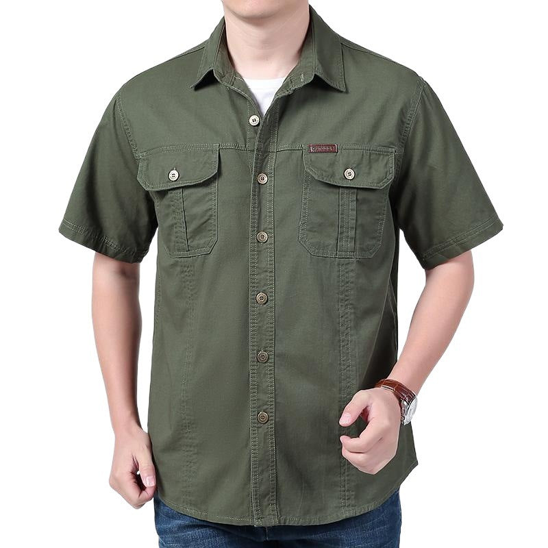 man wearing green short-sleeve button-up casual shirt with front pockets