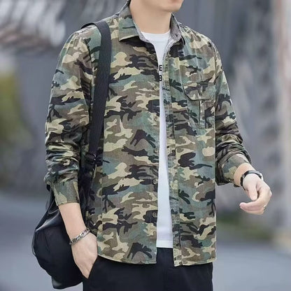 Man wearing casual green camouflage shirt over white t-shirt with black shoulder bag in outdoor setting