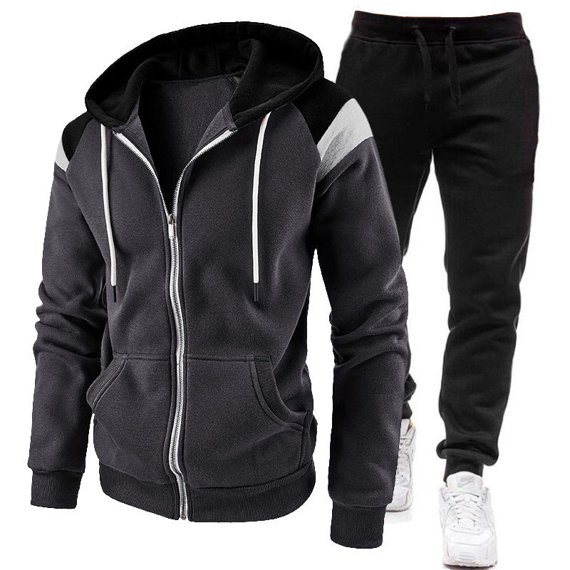 Men's black zip-up hoodie with white drawstrings and black jogger pants with white sneakers