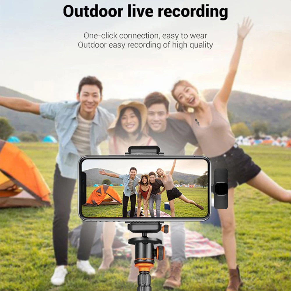 Group of friends outdoors camping taking a live video recording with smartphone on tripod