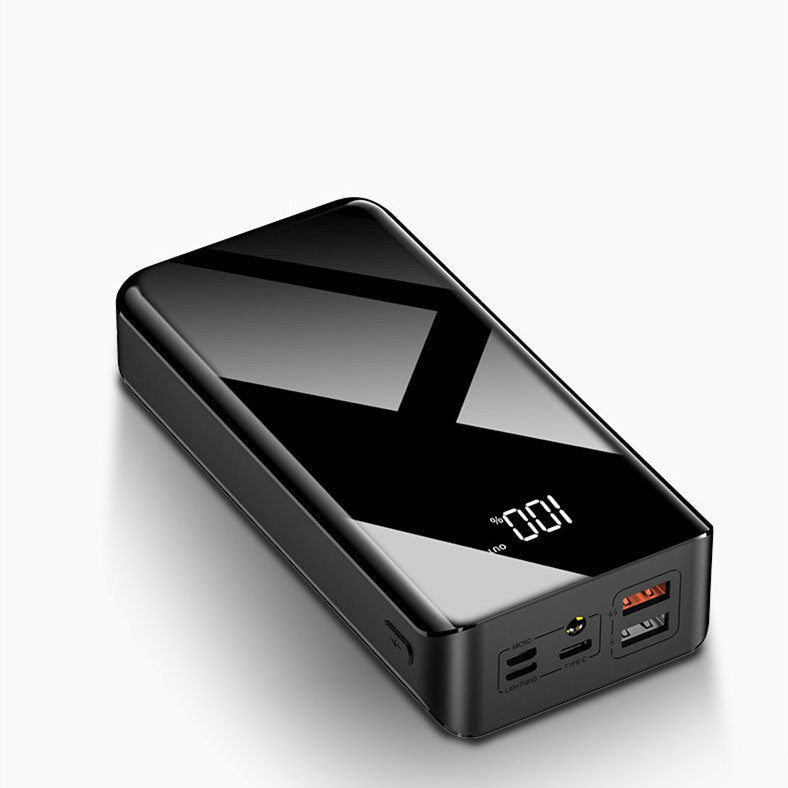 Sleek black portable power bank with digital battery percentage display and multiple USB ports