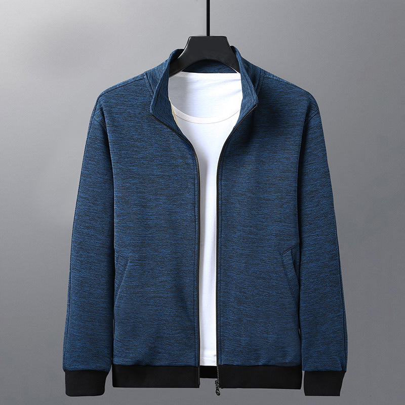 Blue zip-up jacket with black cuffs and hem over a white T-shirt on black hanger
