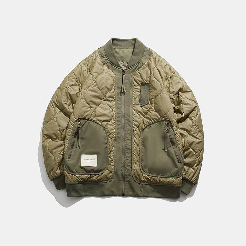 Olive green quilted bomber jacket with large zippered front pockets and ribbed cuffs