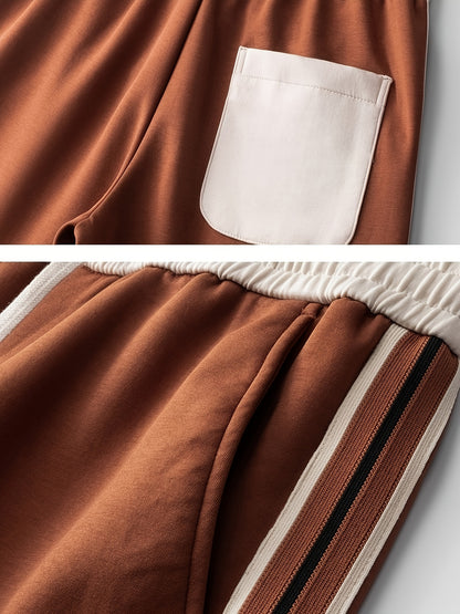 Brown casual pants with white back pocket and elastic waistband featuring side stripe detail