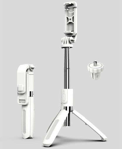 White foldable selfie stick tripod with phone holder and detachable screw mount on gray background