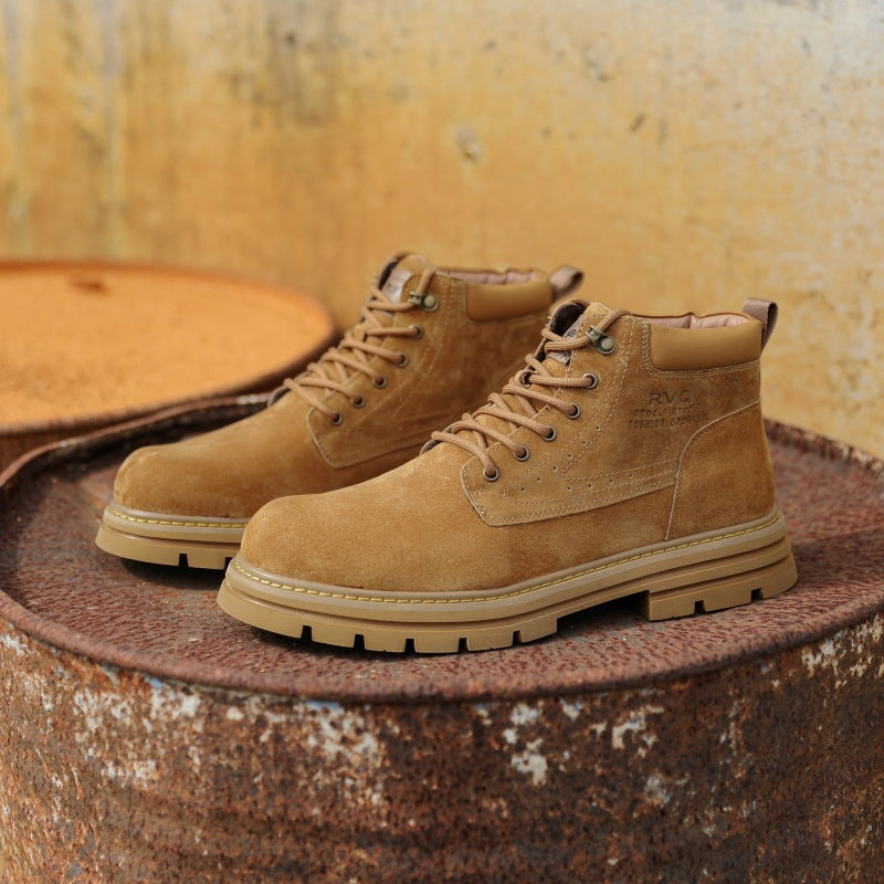 Tan suede lace-up boots with padded collar on rusted metal surface against yellow wall