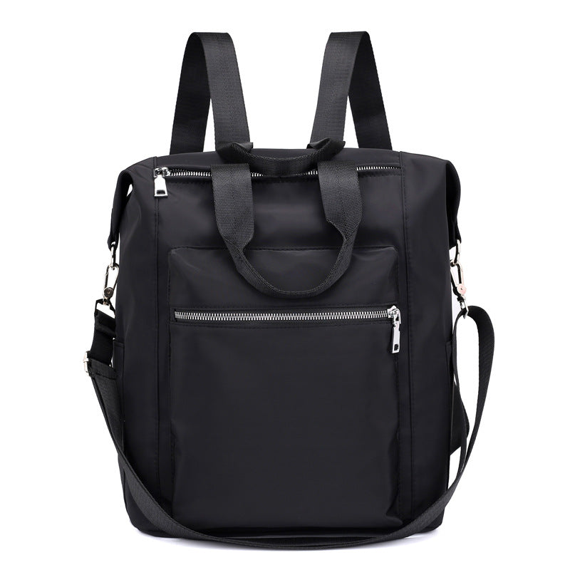 Black multipurpose backpack with front zipper pocket, dual handles, adjustable shoulder straps, and detachable crossbody strap
