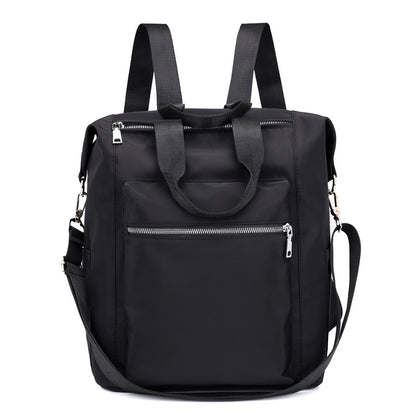 Black multipurpose backpack with front zipper pocket, dual handles, adjustable shoulder straps, and detachable crossbody strap