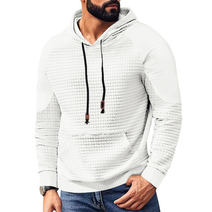 Man wearing white textured quilted hoodie with black drawstrings and front pocket