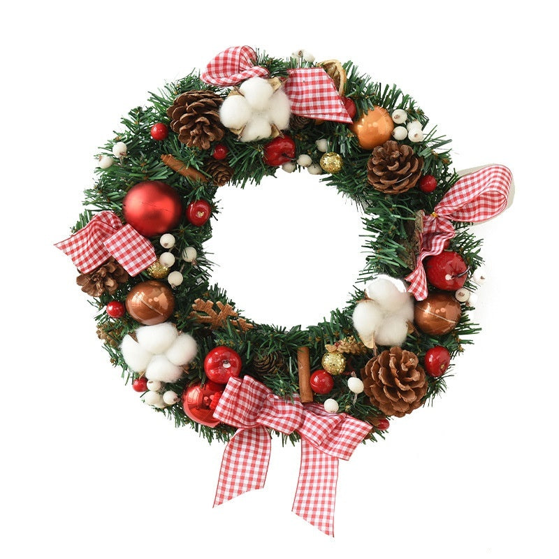 Christmas wreath decorated with pine cones, red and gold ornaments, white cotton balls, and red gingham ribbons