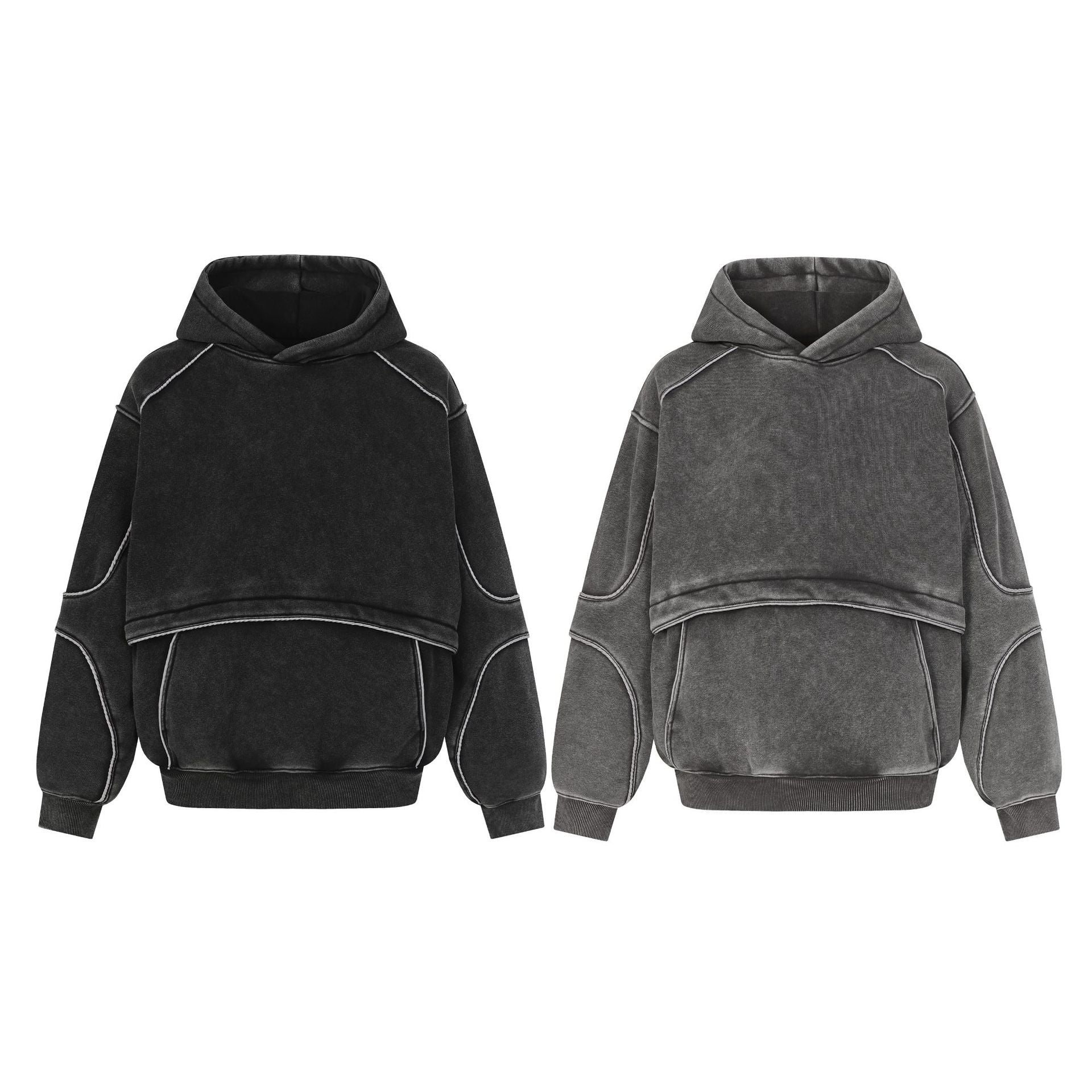 Two oversized hoodies in black and grey with exposed seam details and a layered cropped design