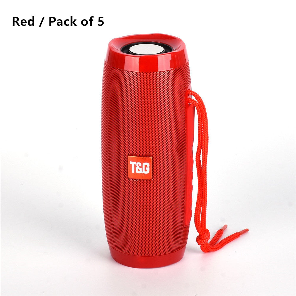 Red portable T&G Bluetooth speaker with cylindrical design and carrying strap