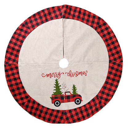 Christmas tree skirt with red and black buffalo plaid border and red truck print with trees