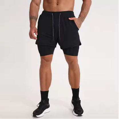 Athletic man wearing black double-layer running shorts with drawstring and compression inner layer