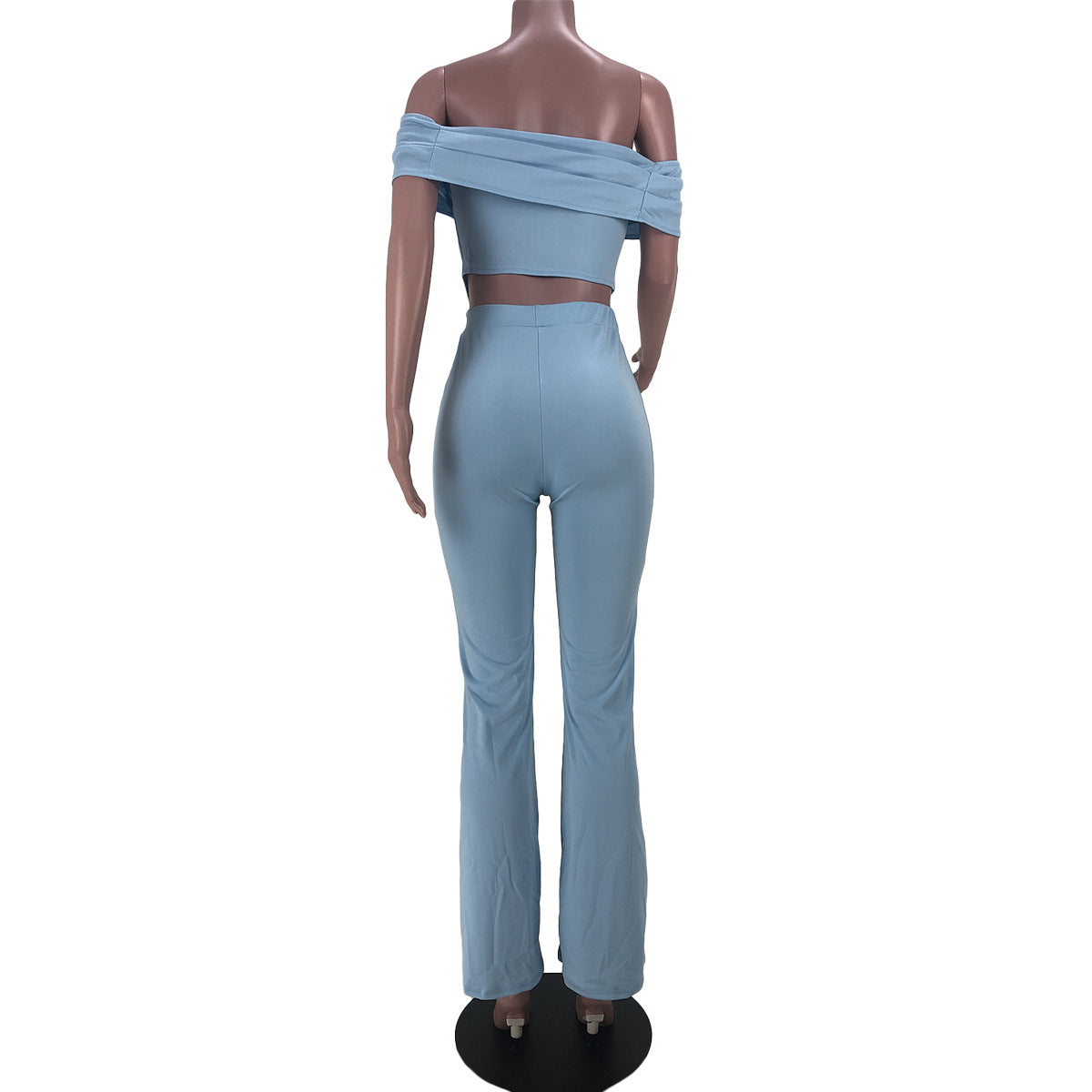 Back view of mannequin wearing light blue off-shoulder crop top and matching high-waist pants set