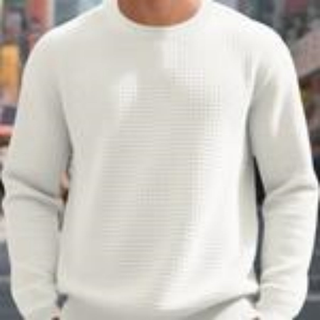 Man wearing white textured crewneck sweatshirt in casual urban setting