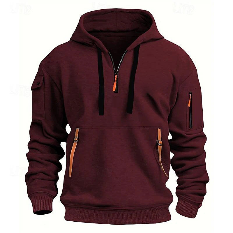 Maroon hooded sweatshirt with black drawstrings, orange zipper pulls, and multiple pockets