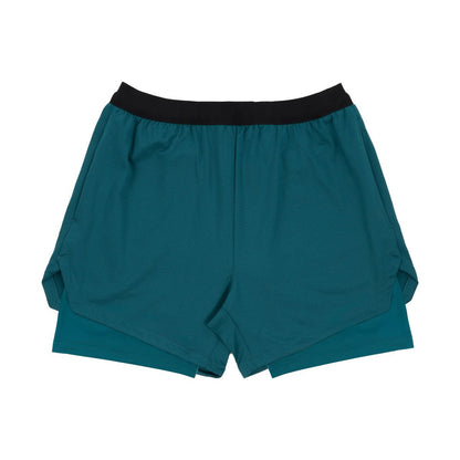 Teal blue double-layer athletic shorts with black elastic waistband on white background