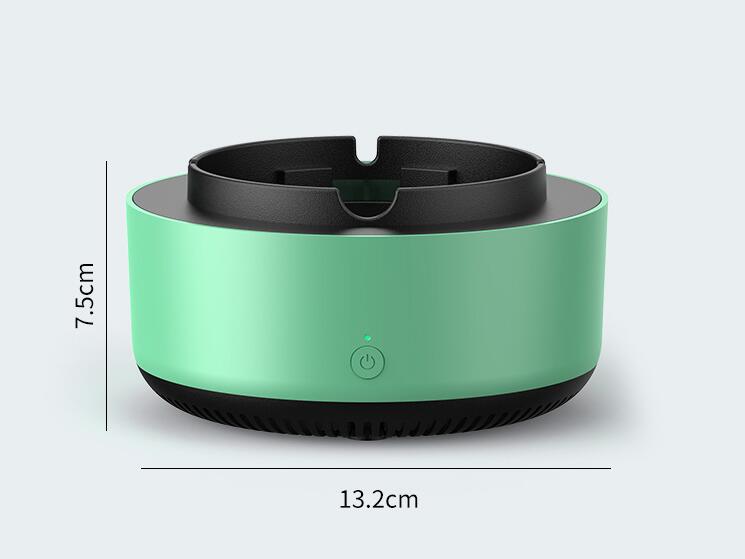 Compact green and black electronic device measuring 13.2cm wide and 7.5cm tall with power button