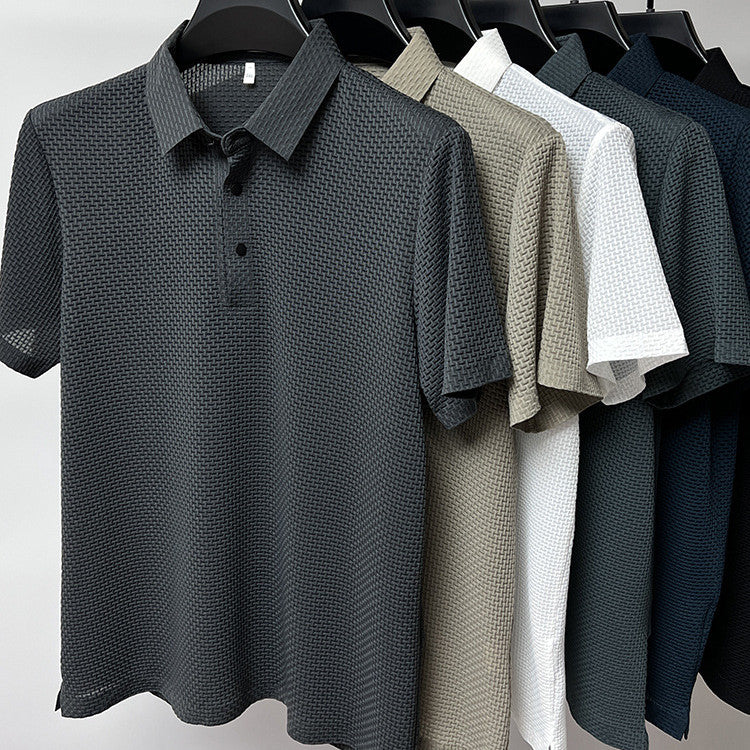 Six textured polo shirts in charcoal, beige, white, gray, navy, and black hung on black hangers