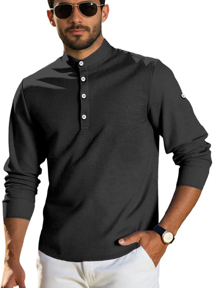 Man wearing black textured long sleeve henley shirt with white buttons and sunglasses
