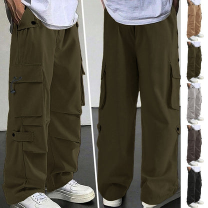 Men's loose fit cargo pants with multiple pockets in olive green, styled with white sneakers and white t-shirt
