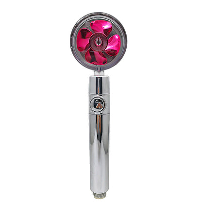 Chrome handheld shower head with transparent red rotating turbine blades and button control