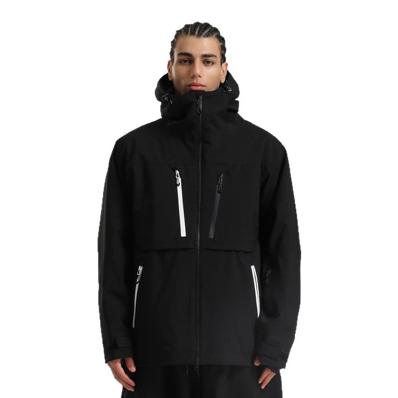 Man wearing black hooded winter jacket with white zipper accents on chest and pockets