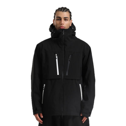 Man wearing black hooded winter jacket with white zipper accents on chest and pockets