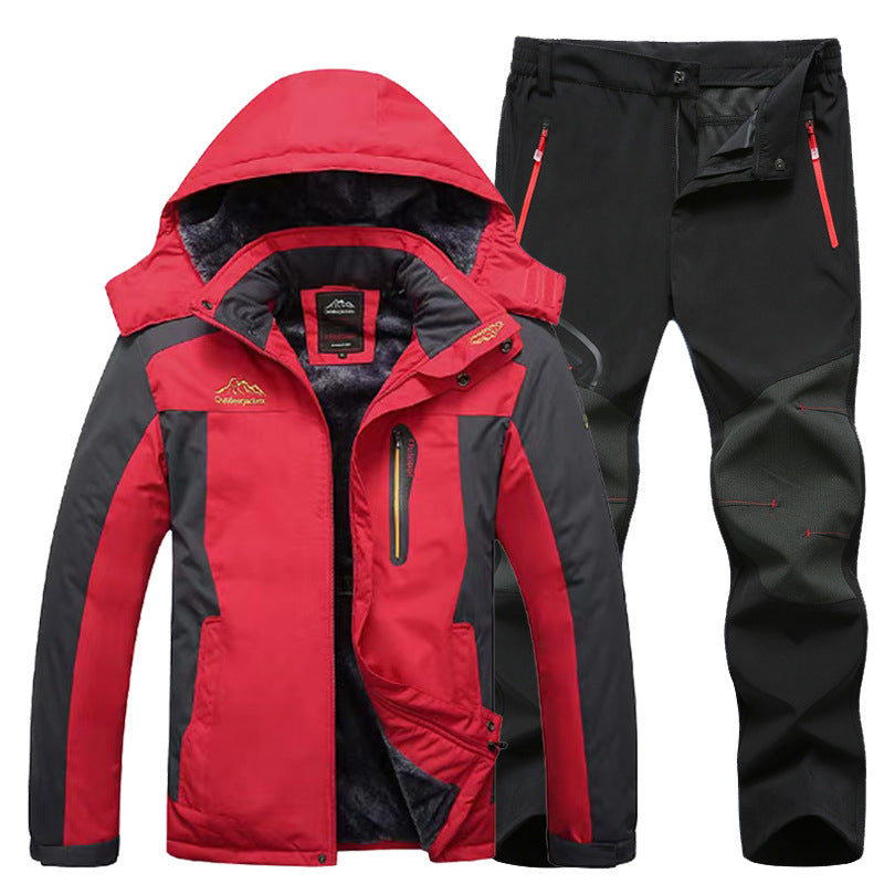 Red and black waterproof winter jacket with hood and black outdoor hiking pants