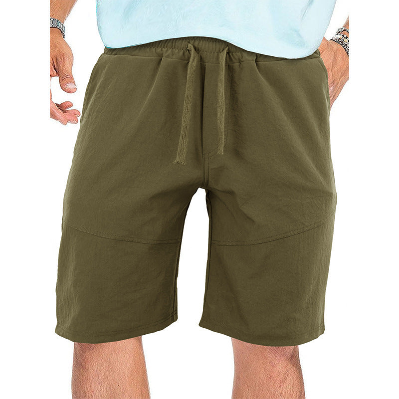 Men's olive green casual drawstring shorts made of lightweight fabric