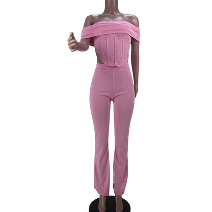 Pink off-shoulder crop top and matching high-waisted pants women's fashion set on mannequin