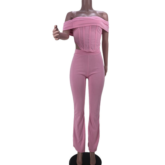 Pink off-shoulder crop top and matching high-waisted pants women's fashion set on mannequin