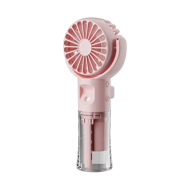 Pink portable handheld fan with transparent water tank and adjustable grip on white background