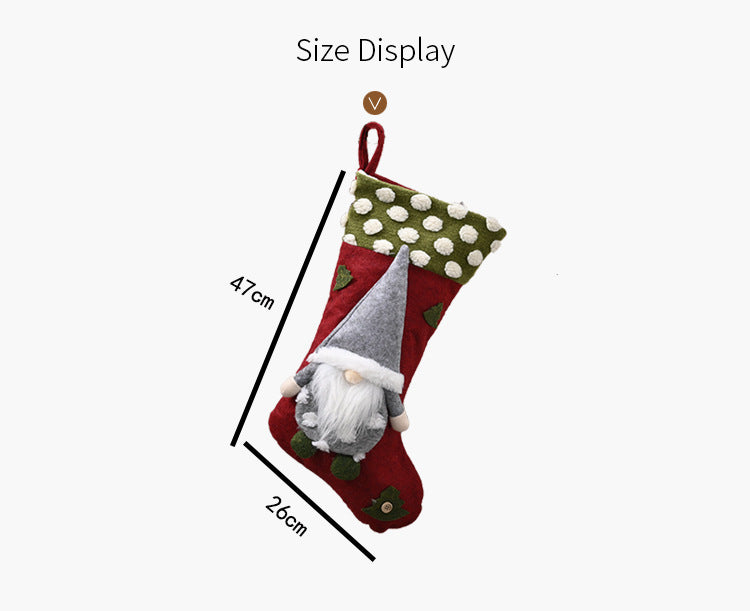 Red and green Christmas stocking with white polka dots and a gray-hatted gnome, 47x26cm size display