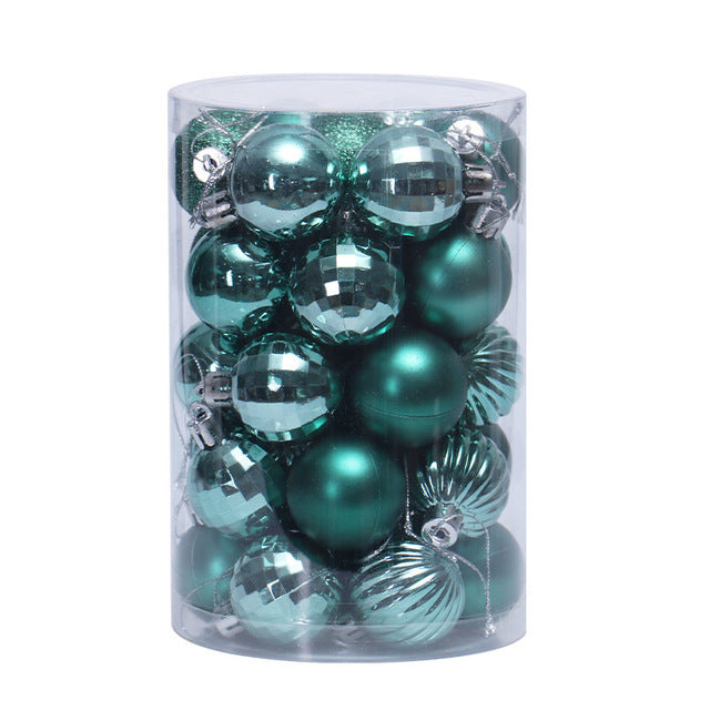 Clear cylindrical container filled with teal and silver Christmas ball ornaments in various finishes
