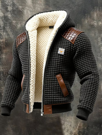 Black textured men's hooded jacket with white sherpa lining and brown leather accents on shoulders and pockets