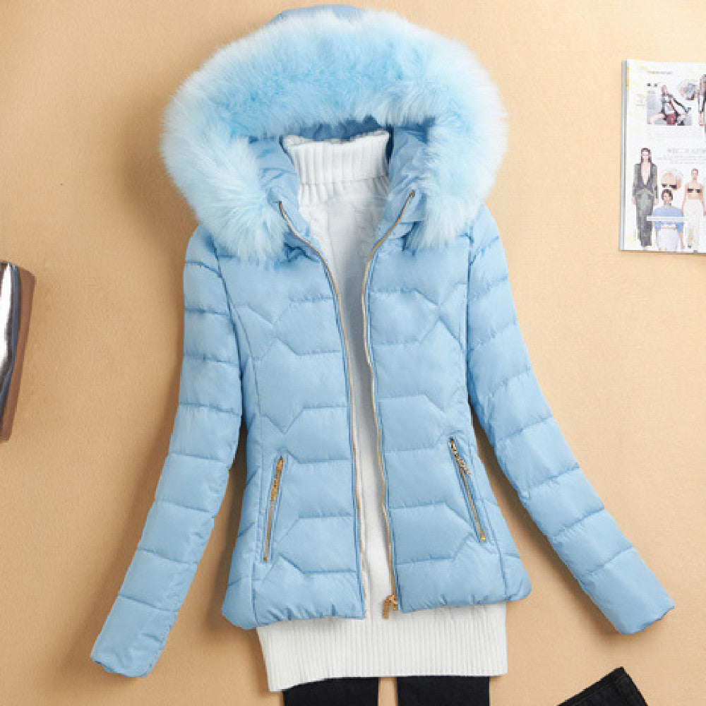 Light blue women's quilted winter jacket with fur-lined hood and gold zipper details