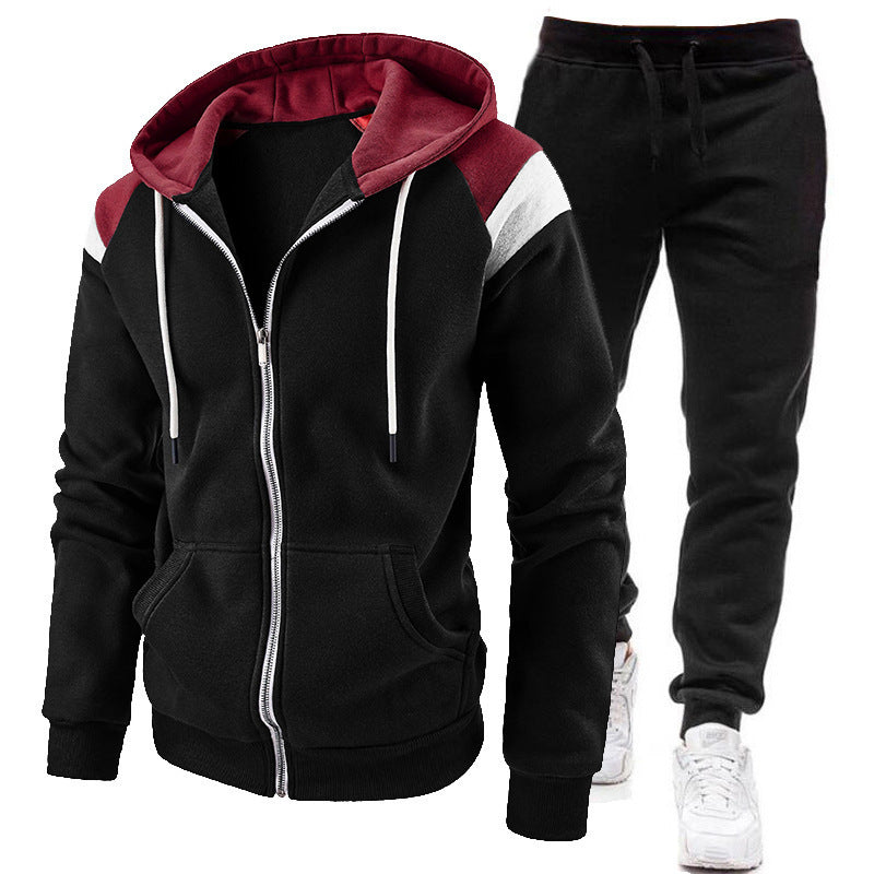 Black and burgundy zip-up hoodie with matching black jogger pants and white sneakers