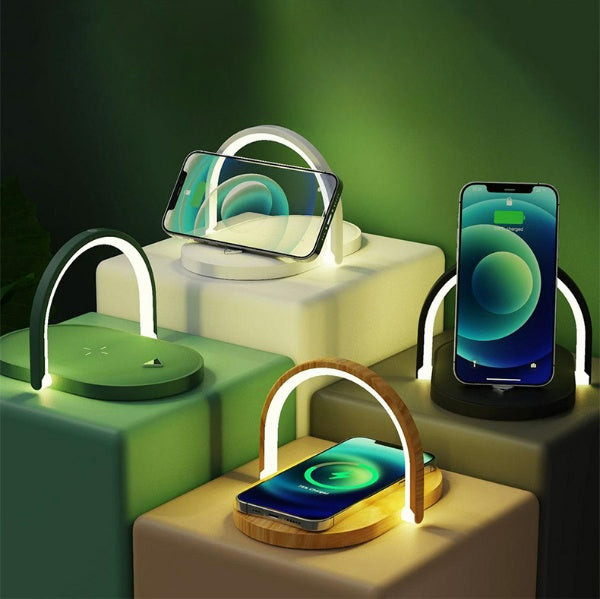 Modern wireless charging stands with built-in LED arches charging smartphones on green and beige blocks