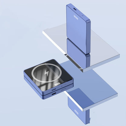 Compact blue wireless charger and portable power bank on reflective surfaces