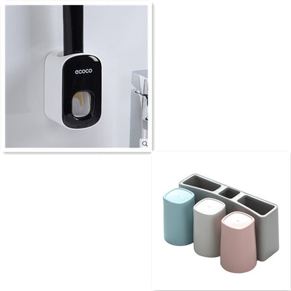 Wall-mounted black and white Ecoco toilet brush and pastel blue, gray, pink toothbrush holder set