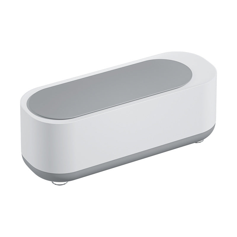 modern white and gray sleek rectangular electronic device with rounded edges on white background