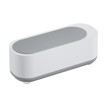 modern white and gray sleek rectangular electronic device with rounded edges on white background