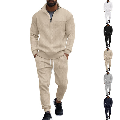 Man wearing beige cable knit quarter-zip sweater and matching jogger pants with black sneakers