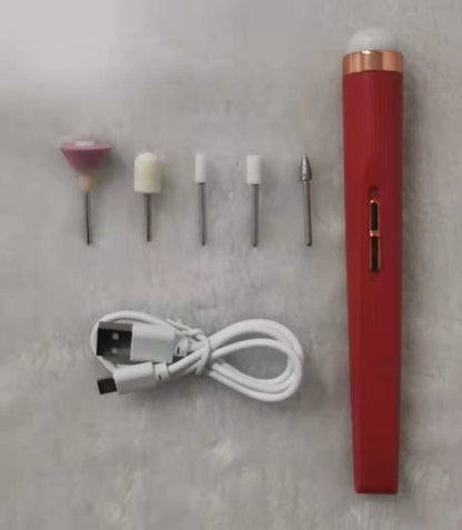 Red electric nail drill kit with five drill bits and a USB charging cable on a gray surface