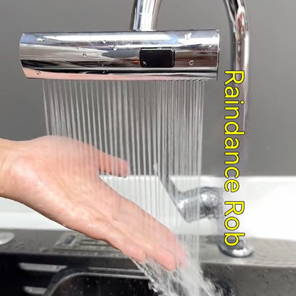 Hand under modern chrome electronic faucet with water streams in kitchen sink